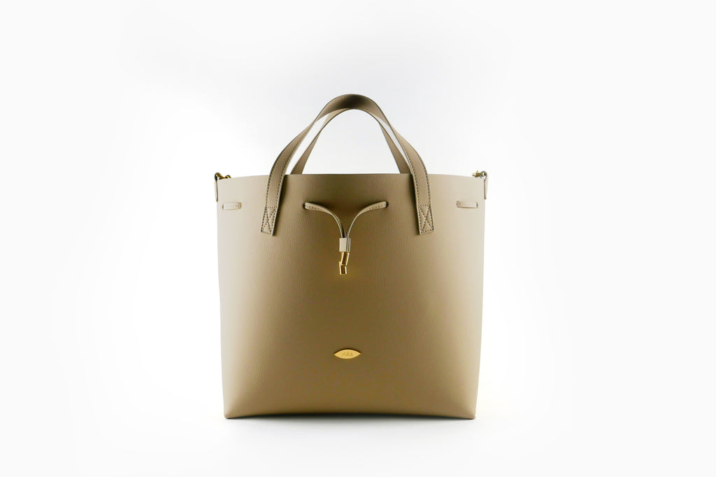 Beige handbag with gold accents on a white background