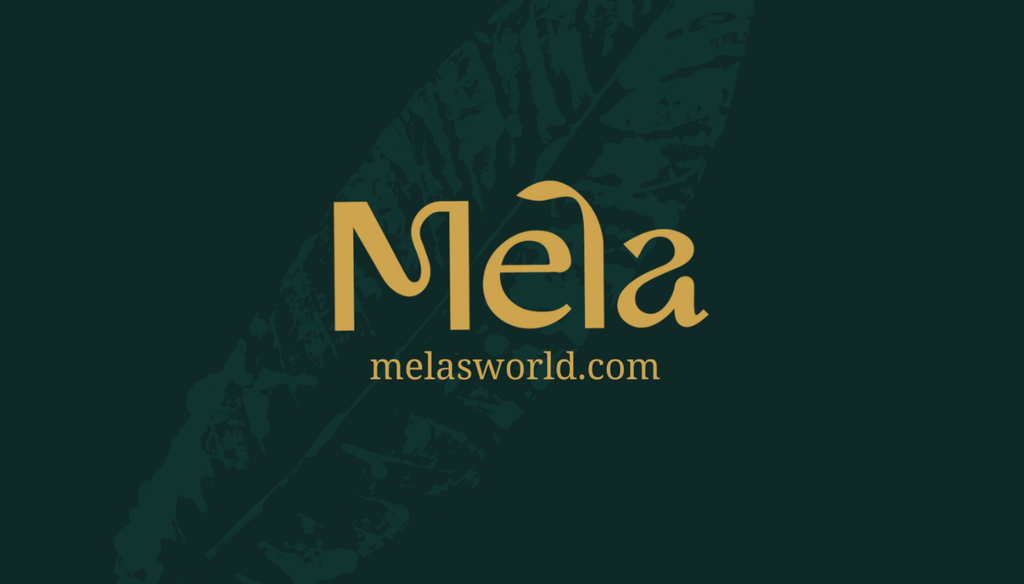 A gift card from Mela's World, with a website URL on a dark green background with leaf details